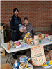 Officer Clark and Records Administrator Martin collecting turkeys at the 'Give a Cop
