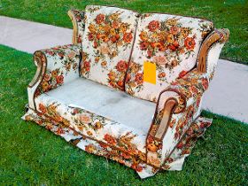 Floral couch sitting on the curb for bulky waste pick up