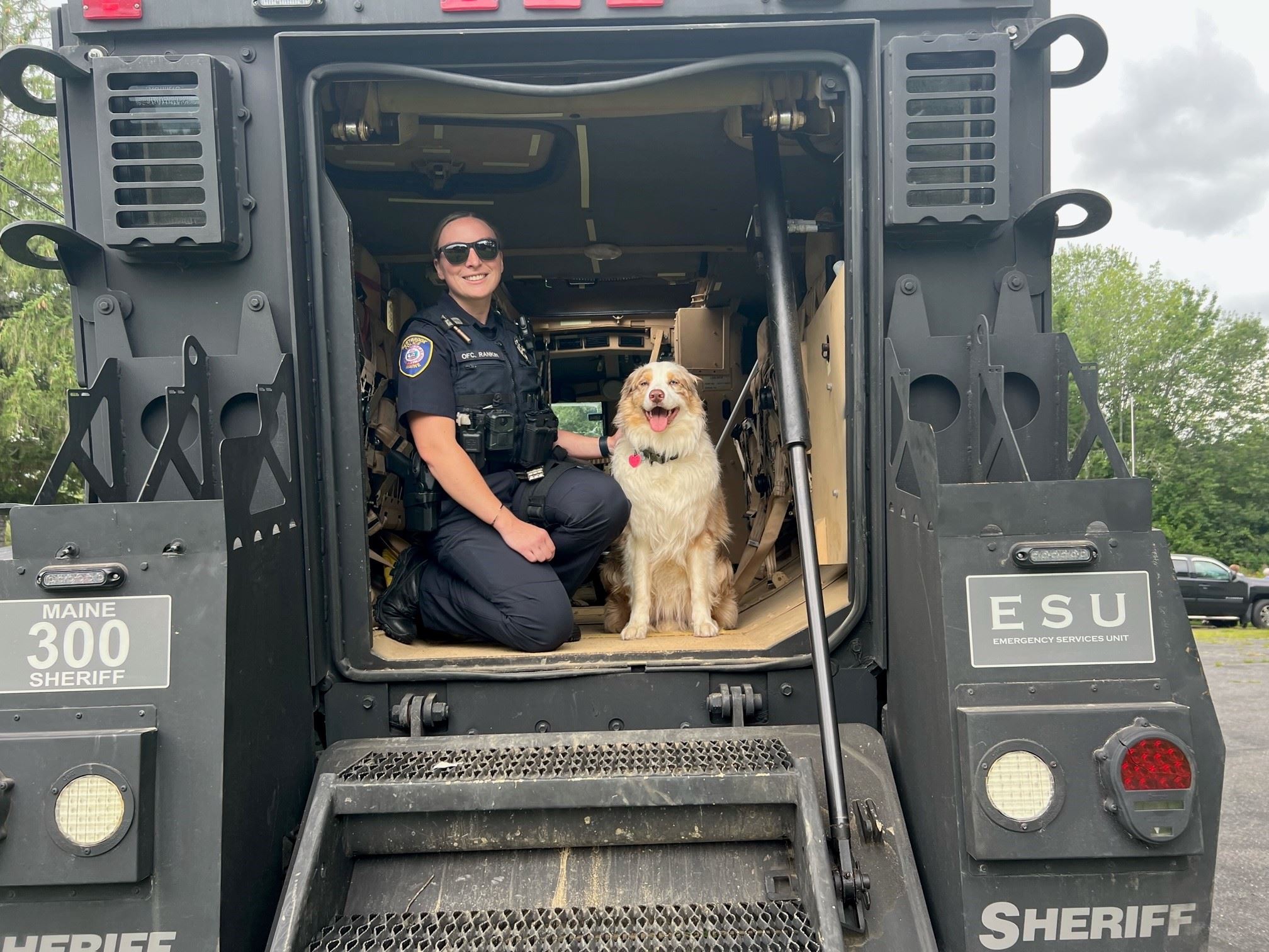 Officer in back of SWAT vehicle